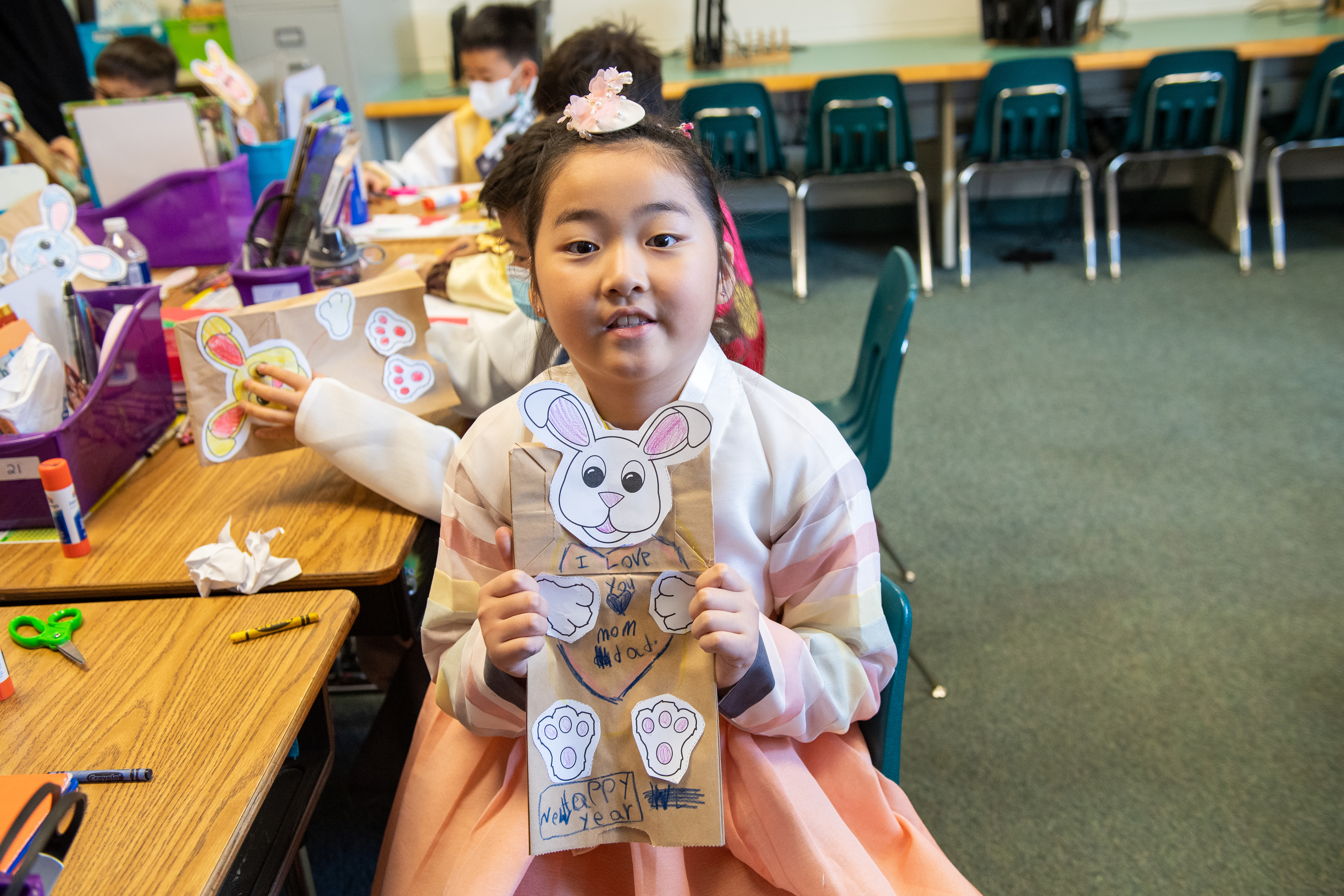 A Powell Elementary kindergarten student displays a bunny puppet she made to honor the Year of the Rabbit.
